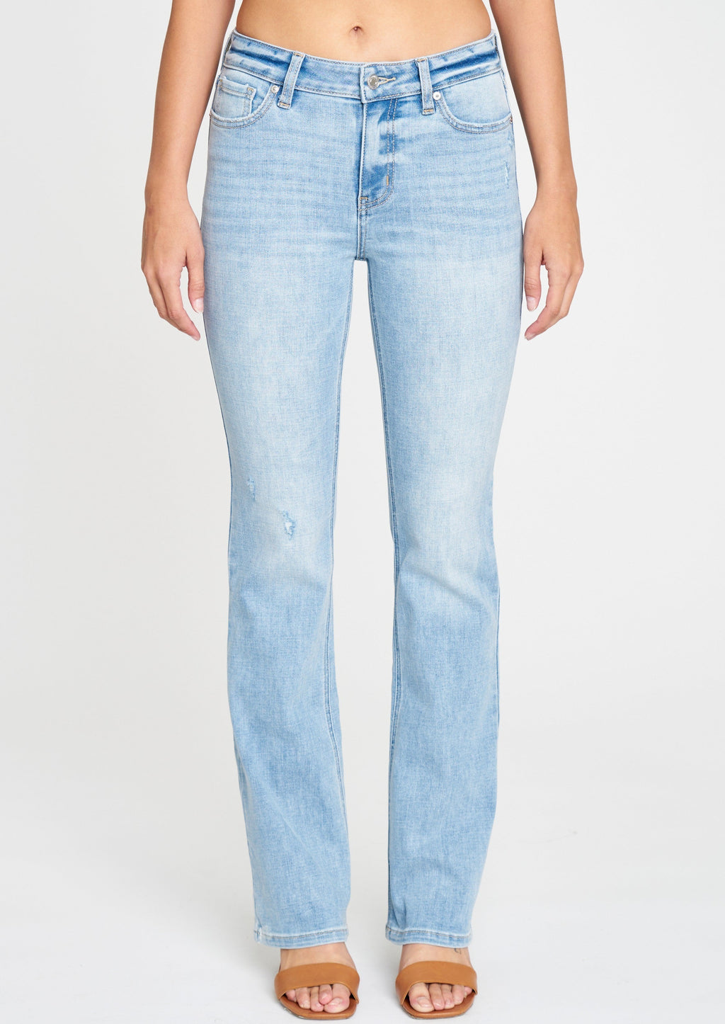 mid rise bootcut jeans in Fanatic. Clean, light wash with five pocket design, light fading, whiskering, and light distressing, and zip fly. This fit features a 9.5 in. mid rise and 32 in. regular inseam.