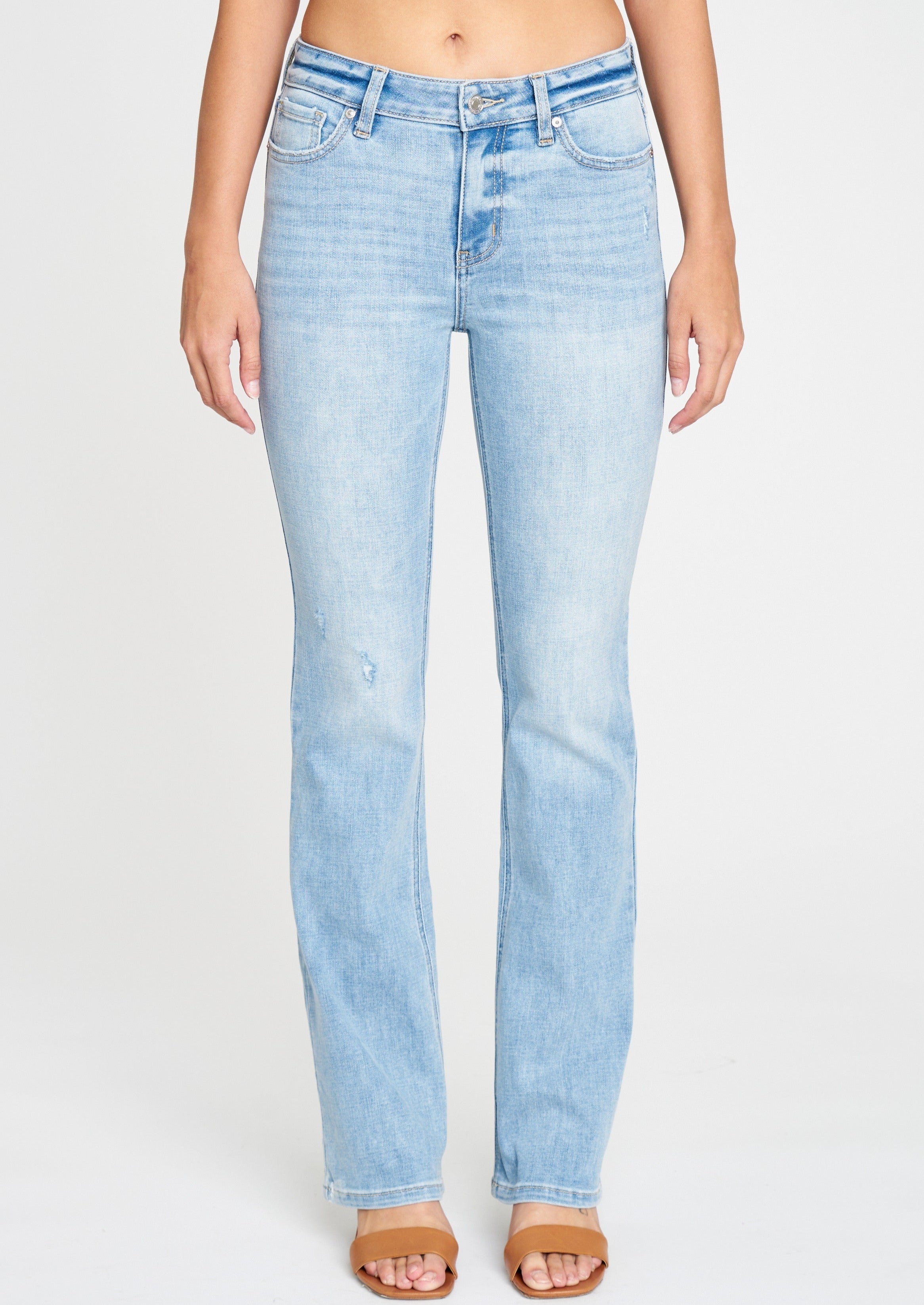 mid rise bootcut jeans in Fanatic. Clean, light wash with five pocket design, light fading, whiskering, and light distressing, and zip fly. This fit features a 9.5 in. mid rise and 32 in. regular inseam.