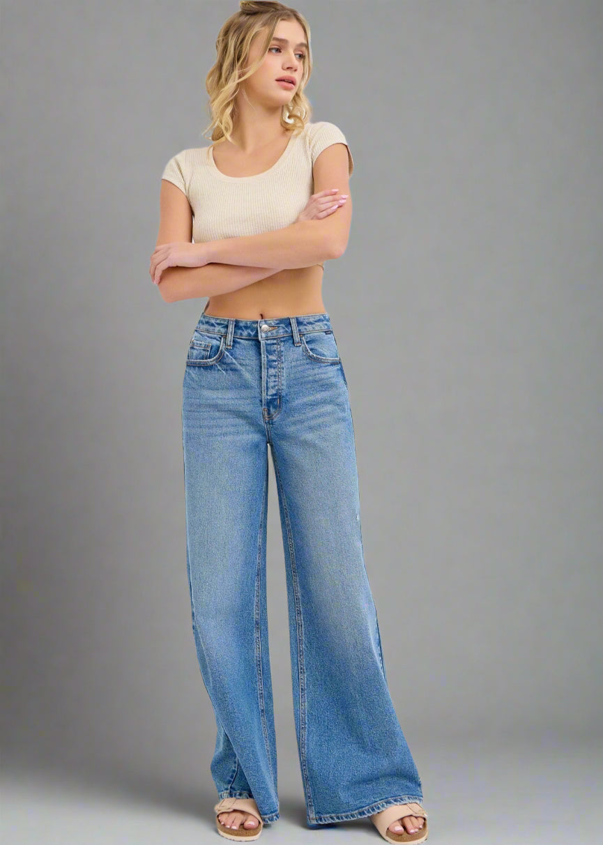 These high-rise wide-leg jeans have a 32" inseam and are the perfect medium wash making them versatile enough to complement any outfit.

Inseam: 32" Rise: 11 1/2"
Fabric Contents
99% Cotton, 1% Spandex