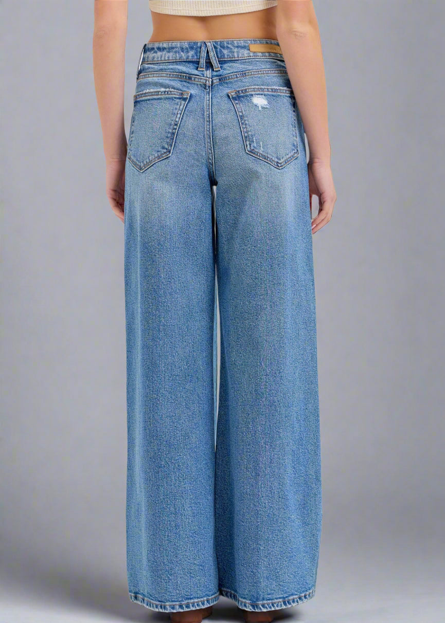 These high-rise wide-leg jeans have a 32" inseam and are the perfect medium wash making them versatile enough to complement any outfit.

Inseam: 32" Rise: 11 1/2"
Fabric Contents
99% Cotton, 1% Spandex