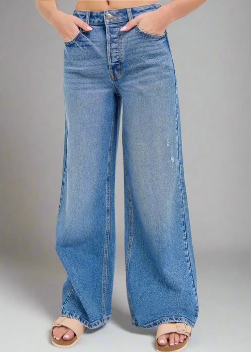 These high-rise wide-leg jeans have a 32" inseam and are the perfect medium wash making them versatile enough to complement any outfit.

Inseam: 32" Rise: 11 1/2"
Fabric Contents
99% Cotton, 1% Spandex