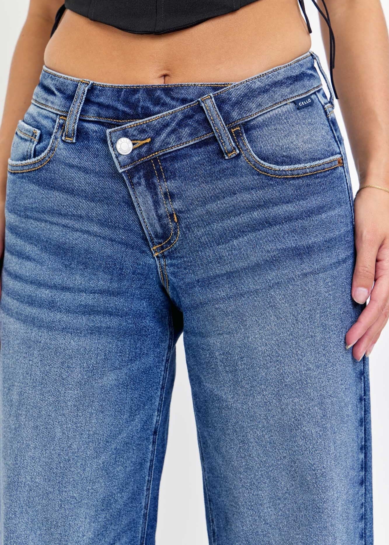 - Low-Rise Wide Leg
- Repositioned Closure
- Medium Denim
- 5 pockets
- Import
- Inseam: 32" Rise: 9 1/2"
- Model is 5'9 wearing size 3
Show Less
Fabric Contents
94% Cotton,4% Polyester,2% Spandex