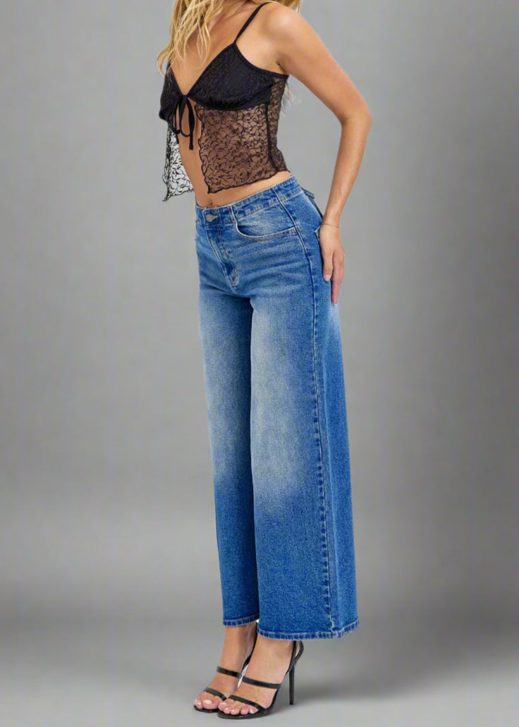 - High-Rise Wide Leg
- Back Lace Details
- Belt loops + Zip fly
- Medium Denim 
- Import
- Inseam 27" Rise: 11 1/2"
- Model is 5'9 wearing size 3
Show Less
Fabric Contents
99% Cotton, 1% Spandex