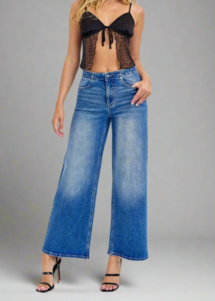 - High-Rise Wide Leg
- Back Lace Details
- Belt loops + Zip fly
- Medium Denim 
- Import
- Inseam 27" Rise: 11 1/2"
- Model is 5'9 wearing size 3
Show Less
Fabric Contents
99% Cotton, 1% Spandex
