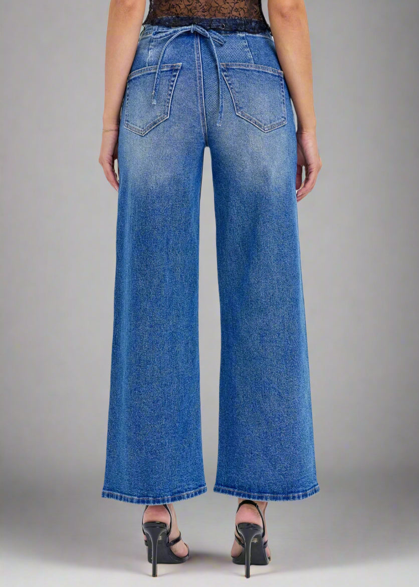 - High-Rise Wide Leg
- Back Lace Details
- Belt loops + Zip fly
- Medium Denim 
- Import
- Inseam 27" Rise: 11 1/2"
- Model is 5'9 wearing size 3
Show Less
Fabric Contents
99% Cotton, 1% Spandex