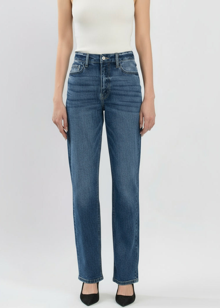 Person wearing blue jeans on a white background