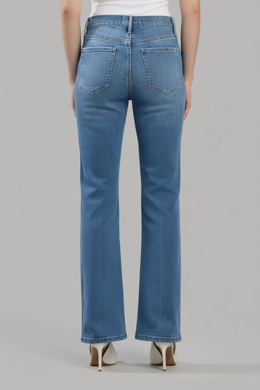 Person wearing blue jeans on a white background