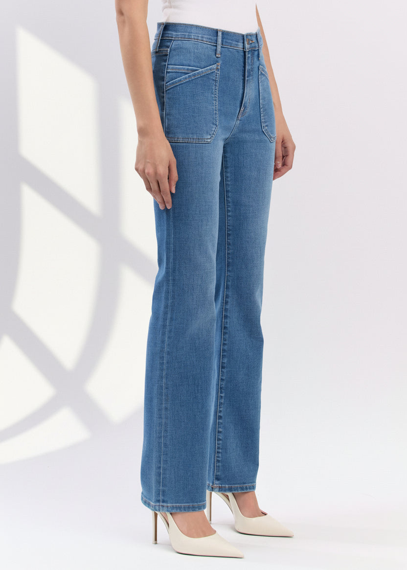 Blue jeans worn by a person on a white background