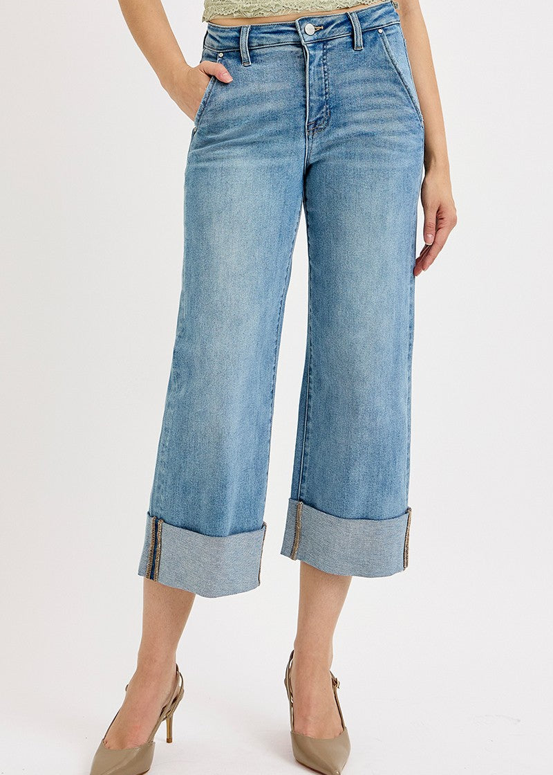 Wide-leg jeans worn by a person on a white background