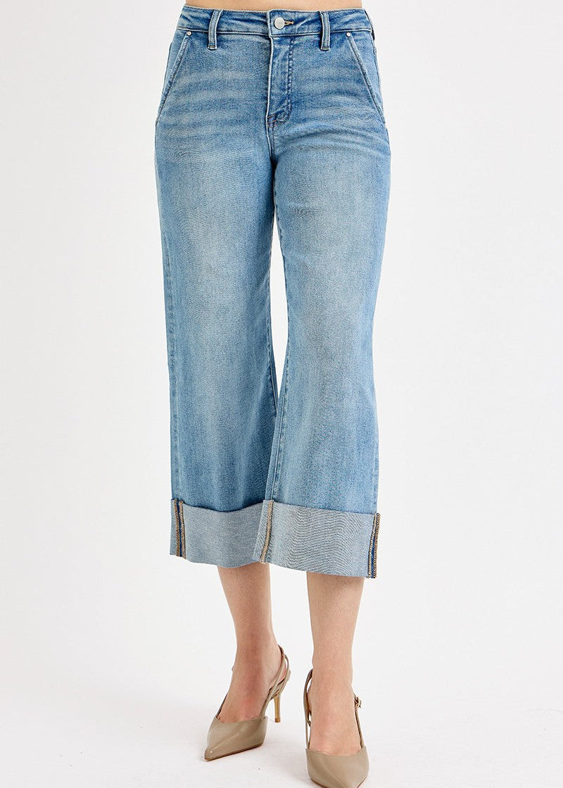Light blue denim culottes worn by a person on a white background