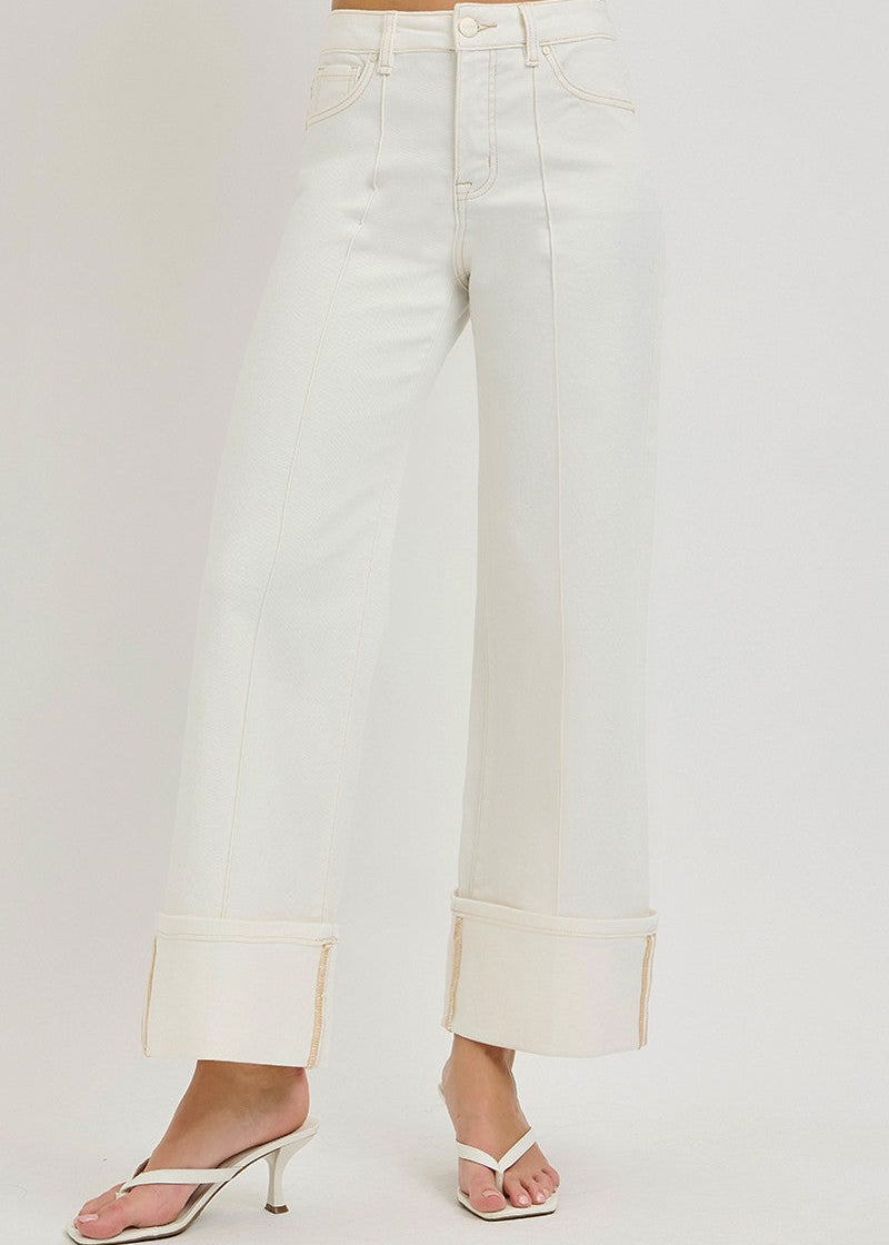 White jeans with a cropped hem on a white background