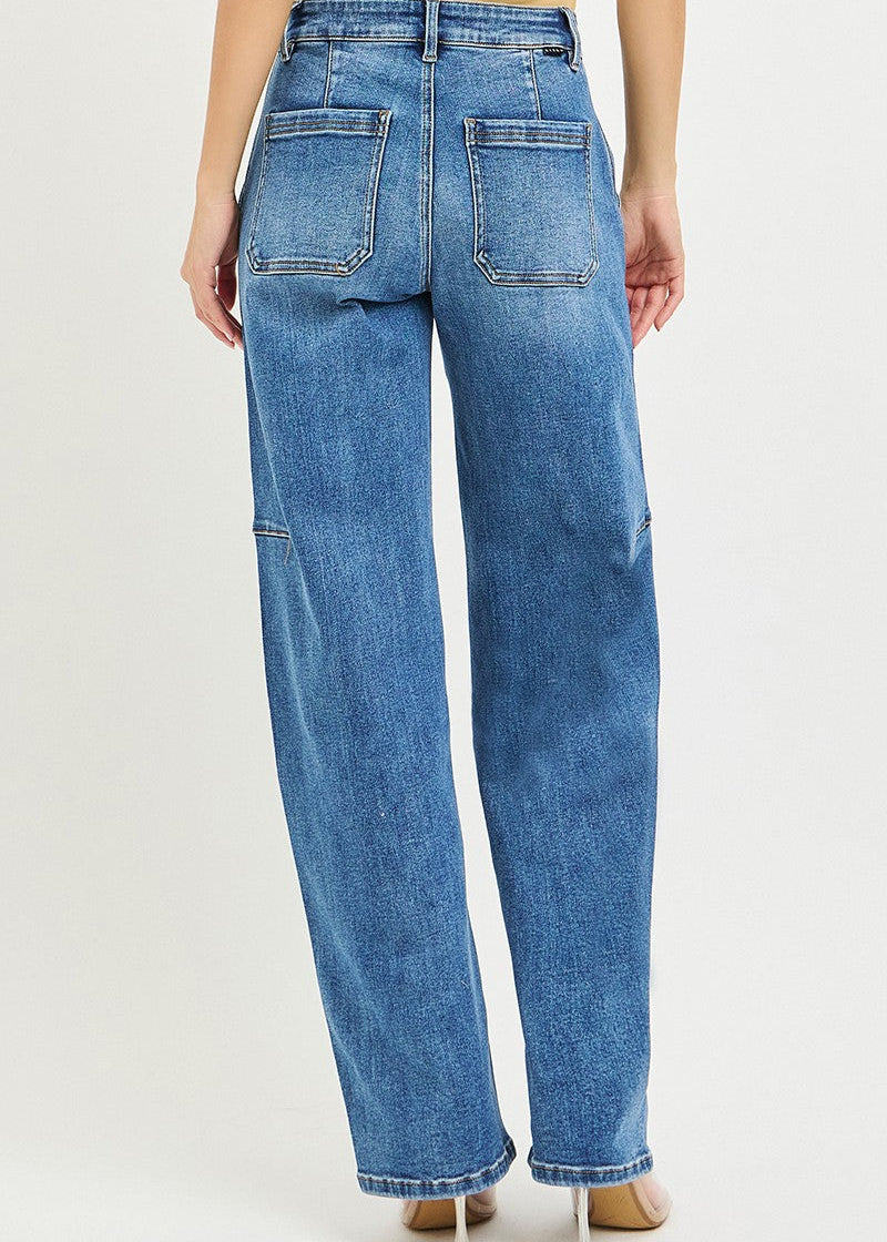Blue jeans worn by a person on a light gray background